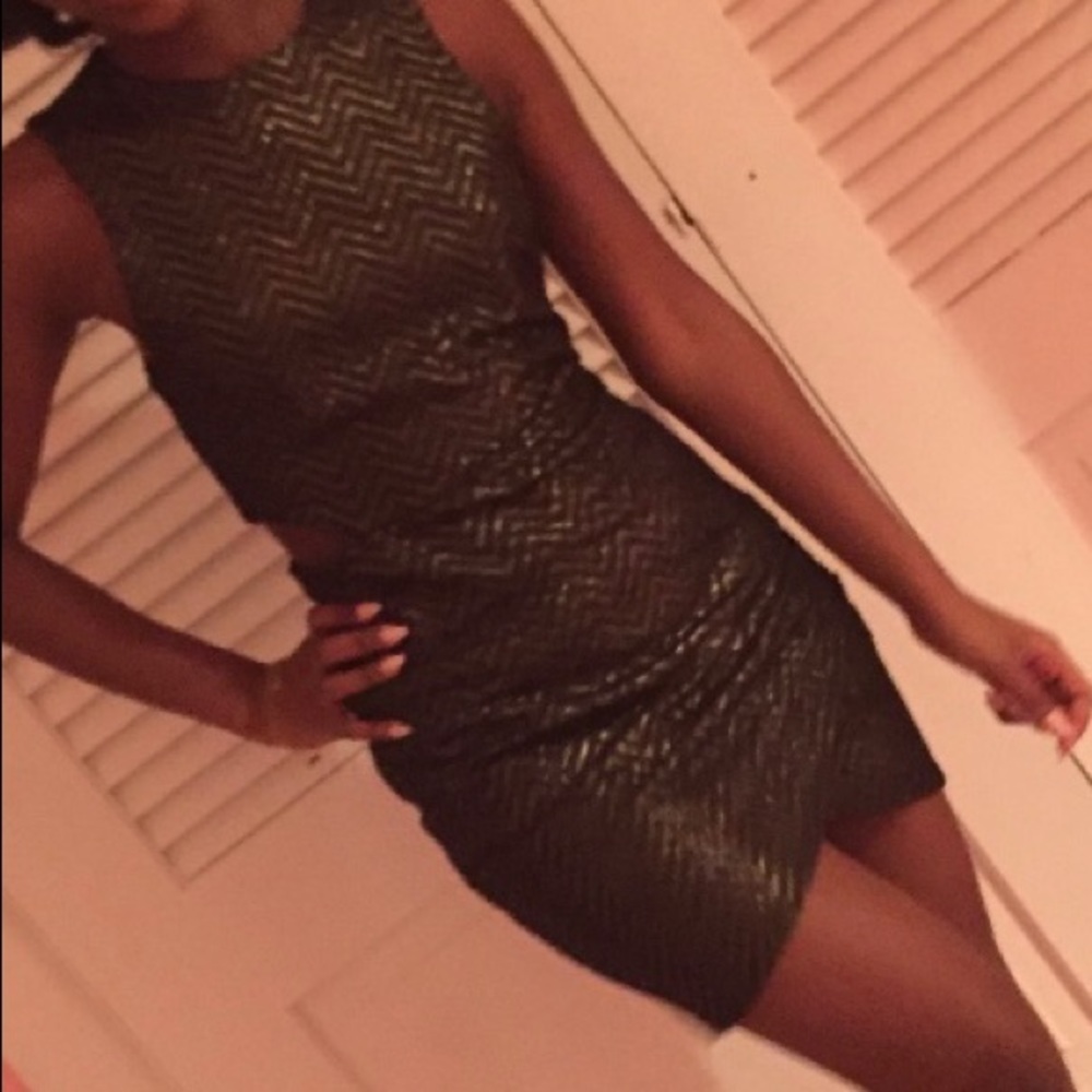 Black and gold Fashion Nova zigzag dress with cut outs on the sides